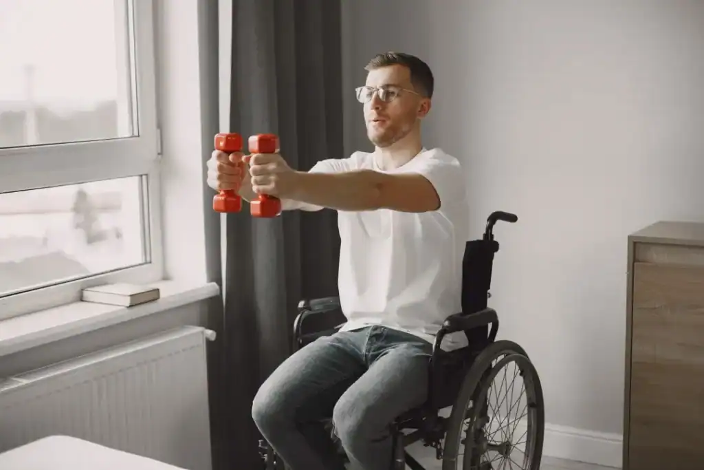 Image of man doing exercise in his wheelchair to aid weight loss Crewe
