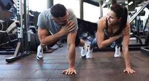 Image of man and woman doing Cardio Crewe to tone their arms. 